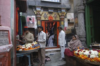 INDIA, Uttar Pradesh, Varanasi , Woman selling flowers at the entrance of Kala Bhairava Temple