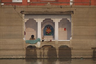 INDIA, Uttar Pradesh, Varanasi , Shrine to the goddess Ganga on the Ganges River near Mir Ghat