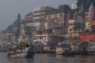 INDIA, Uttar Pradesh, Varanasi , Dashaswamedh Ghat on the Ganges River looking south with boats and