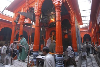 INDIA, Uttar Pradesh, Varanasi, Kala Bhairava Temple. Inner temple with worshippers