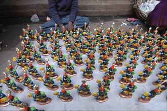 INDIA, Uttar Pradesh, Varanasi, Figurines of Kala Bhairava for sale outside Kala Bhairava Temple