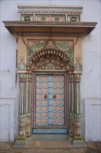 INDIA, Uttar Pradesh, Varanasi , Ghai Ghat. A decorated doorway