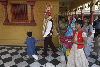 INDIA, Uttar Pradesh, Varanasi , Sankat Mochan Mandir temple. A groom walks around the temple