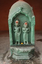 INDIA, Uttar Pradesh, Varanasi , Carved image of Shiva and Parbati at Ghai Ghat