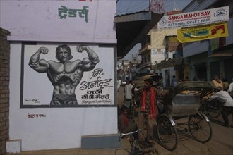 INDIA, Uttar Pradesh, Varanasi, A young Arnold Schwarzenegger painted on a poster for underwear