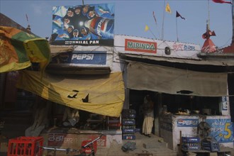 INDIA, Uttar Pradesh, Varanasi, Durga Mundir temple tea shop with Pepsi signs