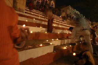 INDIA, Uttar Pradesh, Varanasi, Deep Diwali Festival with oil lamps on steps leading down to the