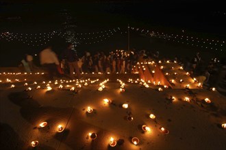INDIA, Uttar Pradesh, Varanasi, Deep Diwali Festival. Oil lamps on the steps leading down to the