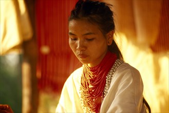 THAILAND, Chiang Mai Province, Portrait of a Lawa woman inside her house