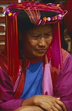 THAILAND, Chiang Rai, Doi Lan. Portrait of a Lisu woman in traditional Lisu attire and hat