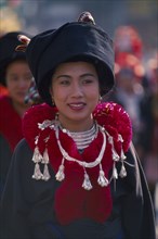 THAILAND, Chiang Mai, Portrait of a young Iu Mien woman in traditional Iu Mien attire