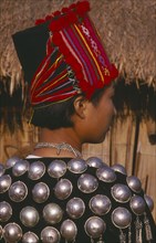 THAILAND, Chiang Mai Province, Muang Nga, Back view of a Jinghpaw woman in traditional jacket and