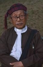 THAILAND, Chiang Mai Province, Samathi Mai, Portrait of a Jinghpaw elder at Manou ceremony