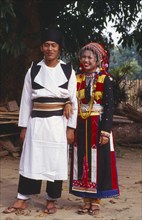 MYANMAR, Kachin State, Manhkring, Lisu man and woman in traditional Lisu attire of the Myitkyina