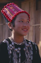 THAILAND, Chiang Mai Province, Muang Nga, Portrait of a Jinghpaw girl wearing traditional womans