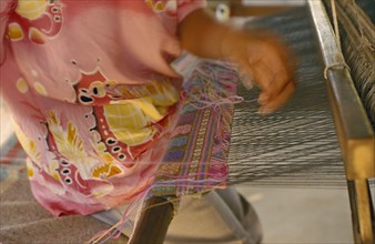 THAILAND, Chiang Mai Province, Mae Ai District, Silk weaving at the weavers group in Bahn Mai Mawk