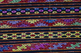 MYANMAR, Kachin State, Myitkyina, Close up detail of a Lacid womans sarong which is traditional