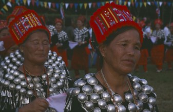 THAILAND, Chiang Mai, Samathi Mai, Kachin Manou Dance. Jinghpaw women in traditional costume during