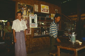 MYANMAR, Kachin State, Manhkring, AIDS signs surrounding mirror in a restaurant