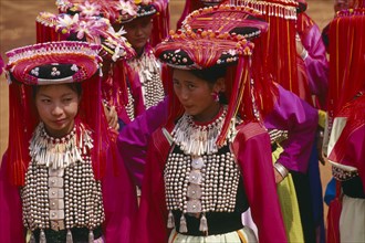 THAILAND, Chiang Rai Province, Huai Khrai, Young Lisu women dressed in their New Year finery