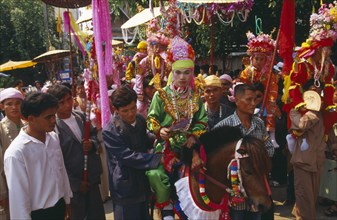 THAILAND, Chiang Mai, Shan Poi San Long. Crystal Children ceremony with Luk Kaeo in costume riding