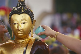 THAILAND, Chiang Mai, Wat Jedi Luang, Inthakhin Ceremony. Bathing Phra Fon Saen Ha Buddha statue