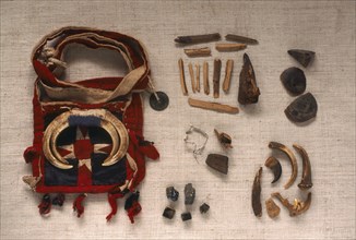 THAILAND, General, "Yao Shamans bag decorated with wild boar tusks and contents of wood, shells,