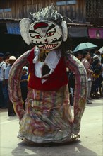THAILAND, Loei Province, Dan Sai, Phi Ta Khon or Spirit Festival. Person wearing spirit costume