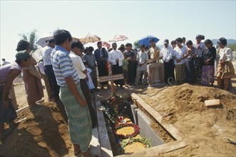 MYANMAR, Kachin State, Myitkyina, Jinghpaw Baptist funeral service with family gathered around