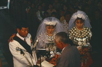 MYANMAR, Kachin State, Myitkyina, Jinghpaw wedding service with Bride and Groom at the Geis