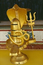 THAILAND, Chiang Mai Province, Golden statue encorporating the symbols of the Hindu god Siva at the