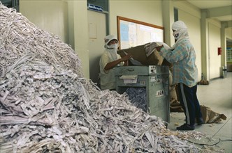 THAILAND, Chiang Mai Province, Women shredding paper at Mae Jo University