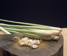 THAILAND, General, Lemon grass with sliced ends on a wood block cutting board