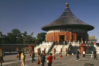 CHINA, Beijing, Temple of Heaven.  Hall of Prayer for Good Harvests exterior and Chinese visitors.