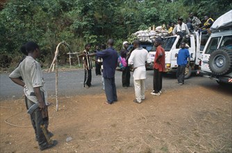 LIBERIA   , Bong, Gbarnga, Trucks stopped at roadblock in area under control of militia forces.