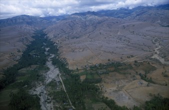 INDONESIA, Sulawesi, Palu Valley, Aerial view over river valley showing fertile flood plain