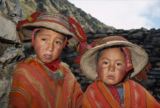 PERU, Andes, Cusco, Tastayoc Village.  Head and shoulders portrait of  Quechua Indian boys wearing