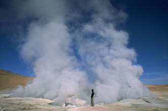 BOLIVIA, Puna de Atacama, Potosi, Sol de la manana.  Steam rising from geothermal vent.