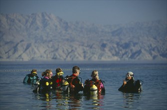 ISRAEL, Eilat, Coral Beach.  Diving class undergoing tuition at Red Sea resort.