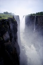 ZIMBABWE, Zambezi River, Victoria Falls, Waterfall plummeting over 355ft sheer cliff face in to a