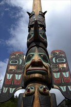 USA, Alaska, Ketchikan, Angled view looking up at a carved wooden Totem pole