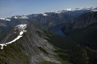 USA, Alaska, Misty Fjords Nat. Monument, Aerial view over mountain range with scattering of snow on