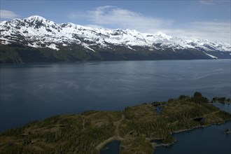 USA, Alaska, Prince William Sound, View over waters toward snow capped mountain peaks