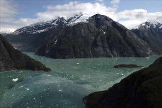 USA, Alaska, Tracy Arm Fjord, View over rocky cliff edged waterways toward mountain peaks