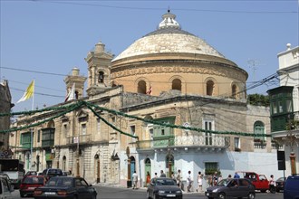 MALTA, Mosta , Street scene and dome roofed church