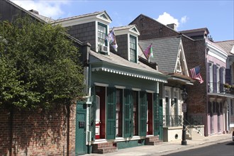 USA, Louisiana, New Orleans, French Quarter. View along row of houses with green shuttered windows