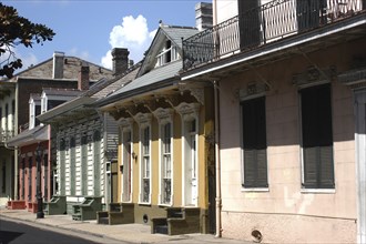 USA, Louisiana, New Orleans, French Quarter. View along pastel coloured architecture with shuttered