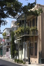 USA, Louisiana, New Orleans, French Quarter. Pastel coloured architecture with ironwork balconies