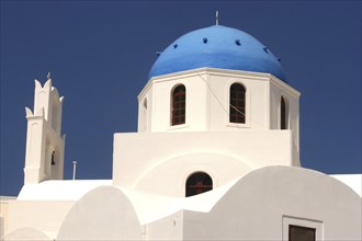 GREECE, Cyclades, Santorini, Blue domed building with whitewashed walls