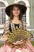 RUSSIA, St Petersburg, Portrait of a girl in historical dress with a hat and fan